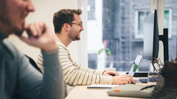 Digital Marketer working at desktop.